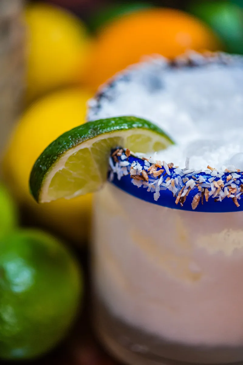 Captain's Hideaway signature coconut cocktail with lime